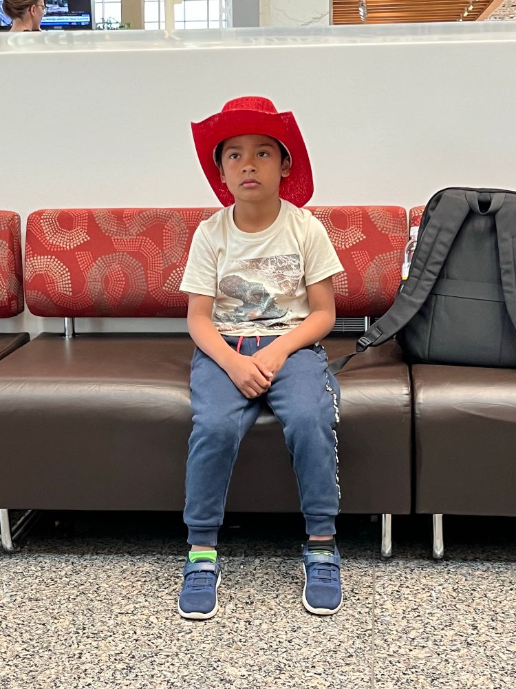 Kid in red cowboy hat 