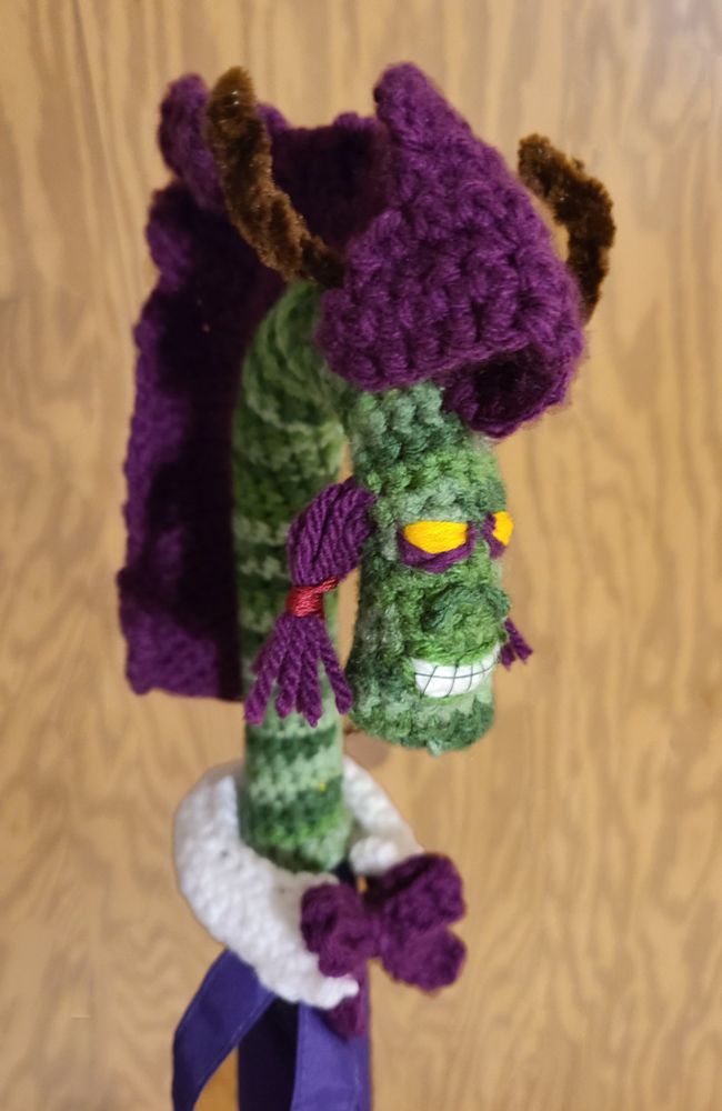 A crochet version of Shudderwock on an umbrella