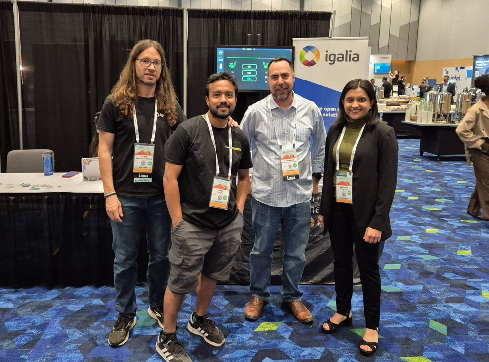 Team members at the booth looking cool.