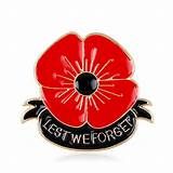 Red poppy above Lest We Forget black ribbon.