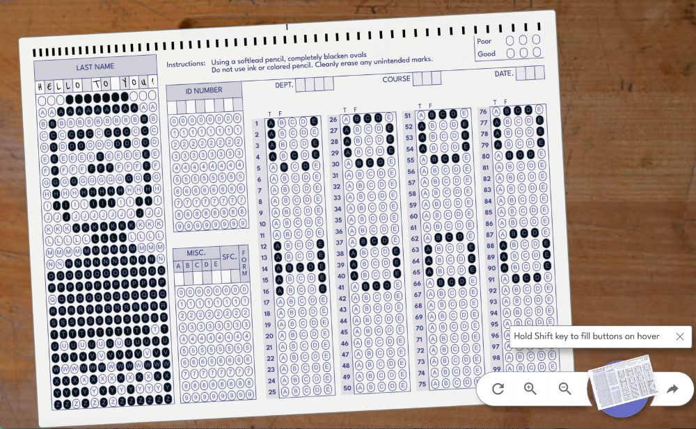 a test paper with blue bubbles that have been filled in to show a smiling man and the letters "WOO HOO"