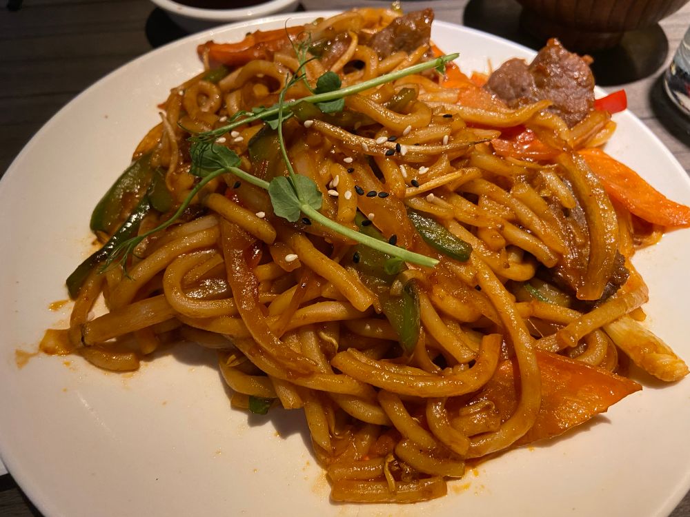 Sliced beef in udon noodles