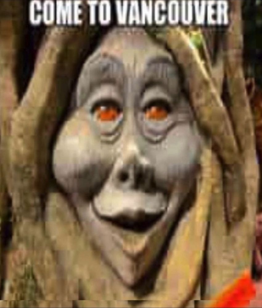 A blurry image of a photo of the talking animatronic tree that can be found in the restaurant Rainforest Cafe. Above the tree reads "COME TO VANCOUVER" in all capital letters.