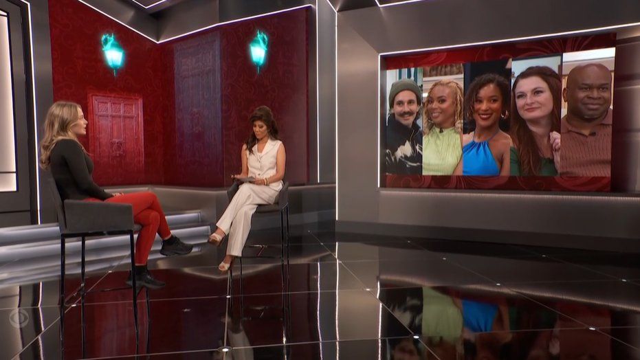 Screenshot from the episode where Julie shows Katherine an image of the members of The Judges that mistakenly includes Mickey.