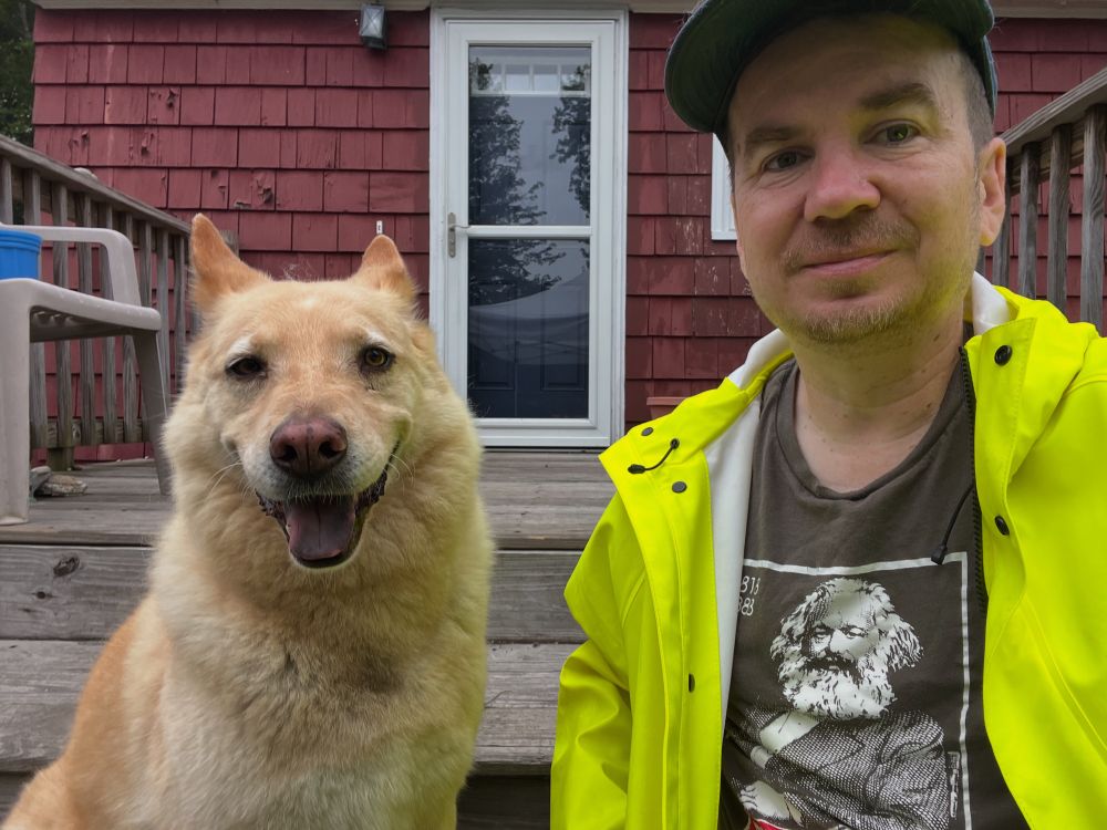 Bento (dog) on left smiling, me on the right