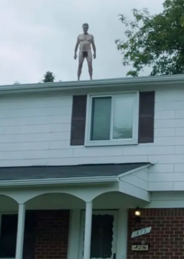 Naked man on roof of house from It Follows