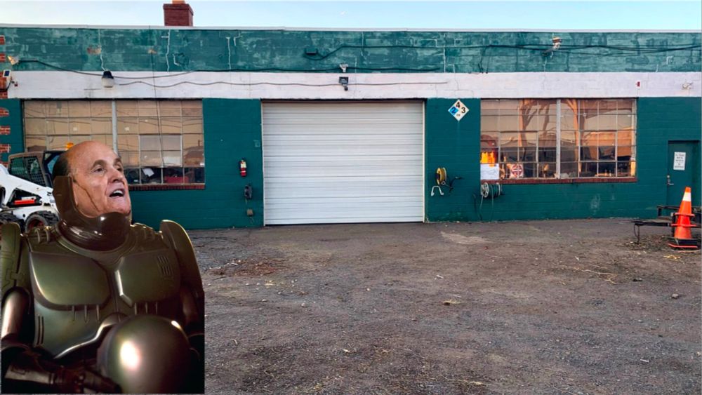 The Four Season Landscaping center. In the foreground, Rudy Giuliani in a full body Robo-Cop exoskeleton. Hair dye drips down the right side of his head (our left) He is tilting his head back and speaking.