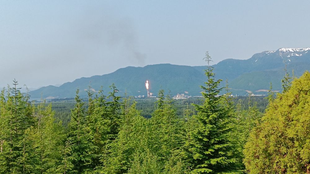 Pair of flare stacks at LNG Canada plant in Kitimat seen from 5 kilometers away.