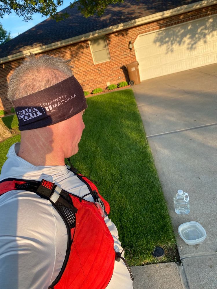 Thirsty runner eyeing the water left out for dogs to drink. 