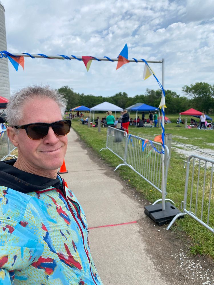 Volunteer standing at the start/finish line. 