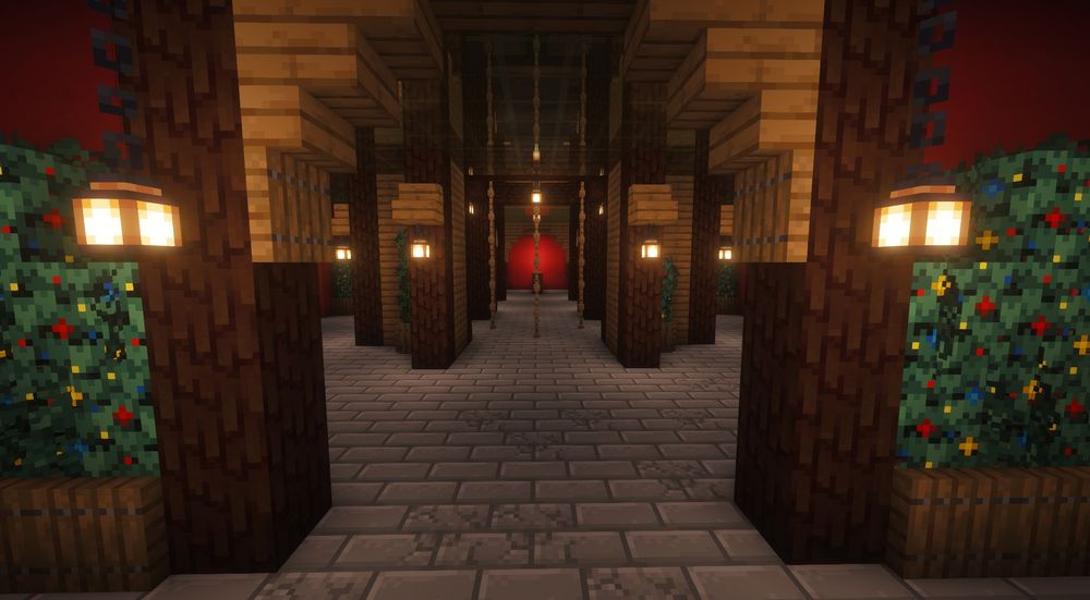 Still image of a minecraft Christmas themed PVP arena. Lanterns hanging from the cieling, rope leading to an upper area of the arena. Christmas themed bushes in the corners.