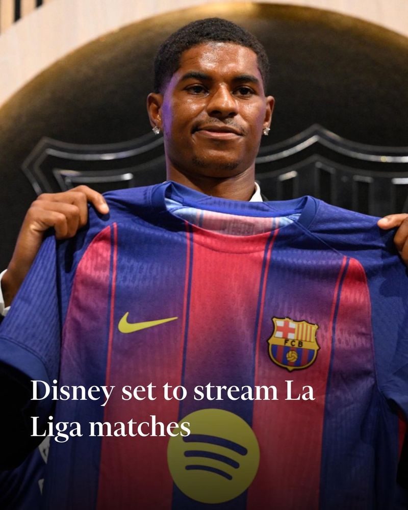 English forward Marcus Rashford who joined Barcelona on loan from Manchester United holds up his new jersey during his official presentation at the Camp Nou stadium in Barcelona on July 23