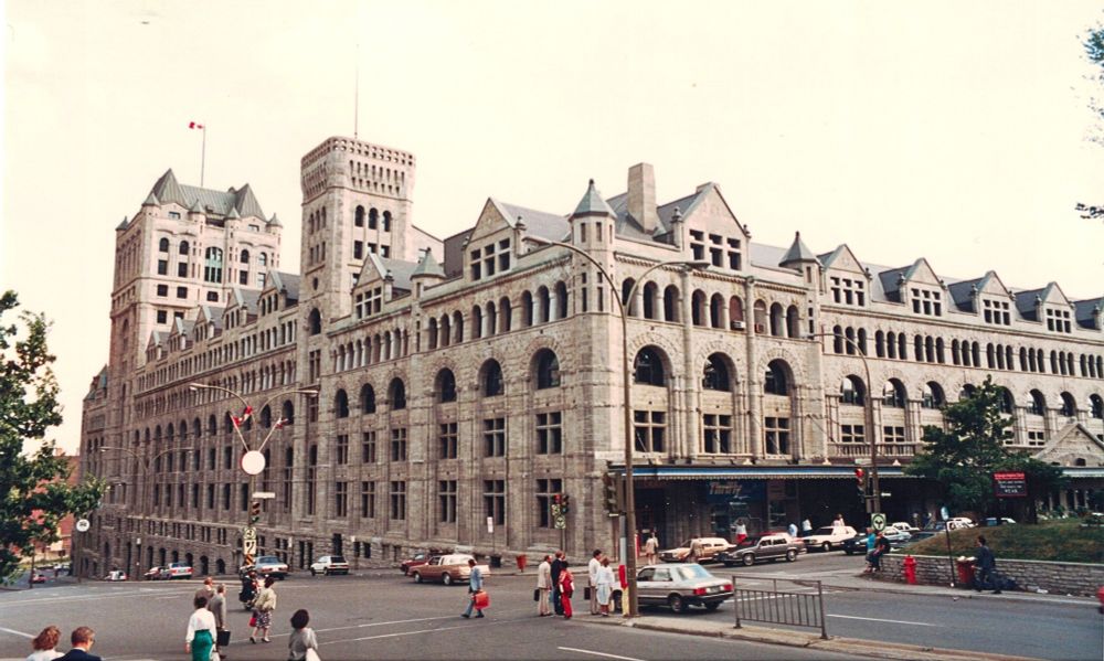A street-level view of the Peel and La Gauchetière Street facades of Canadian Pacific's monumental Chateau-style Windsor Station in downtown Montreal, August 1987.  Photo by Gerry Lee.