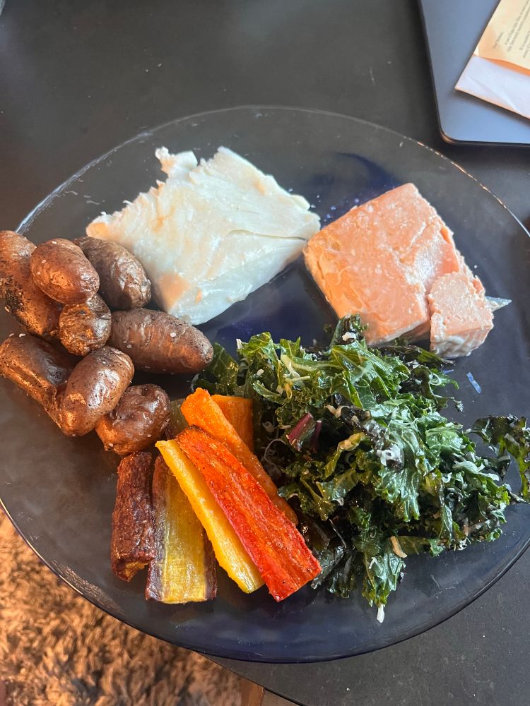 Air fried tricolor carrots, roasted fingerling potatoes, kale salad, and salmon and halibut from my cousin who is a commercial fisherman. 