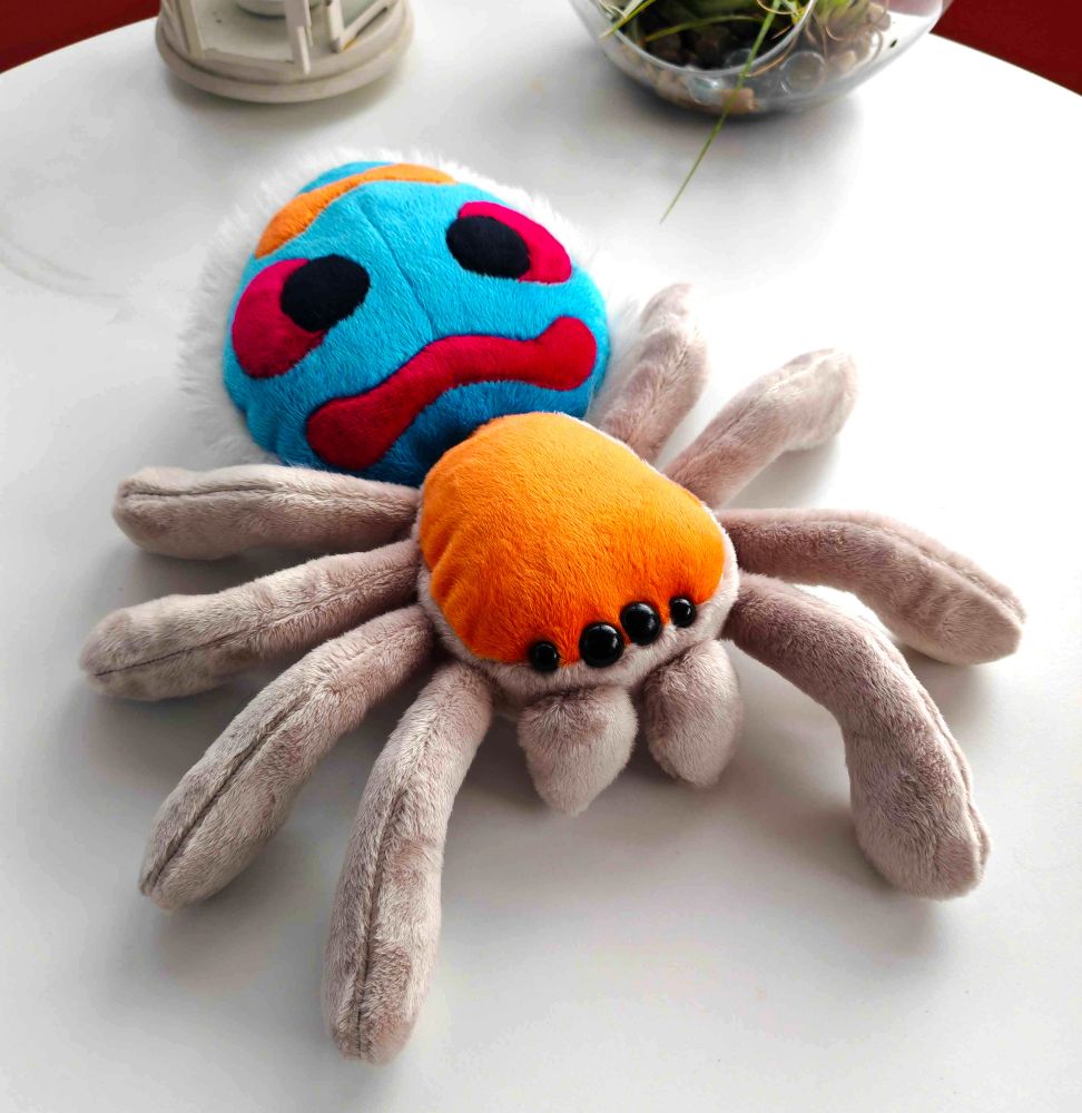 A big handmade peacock spider plushie.