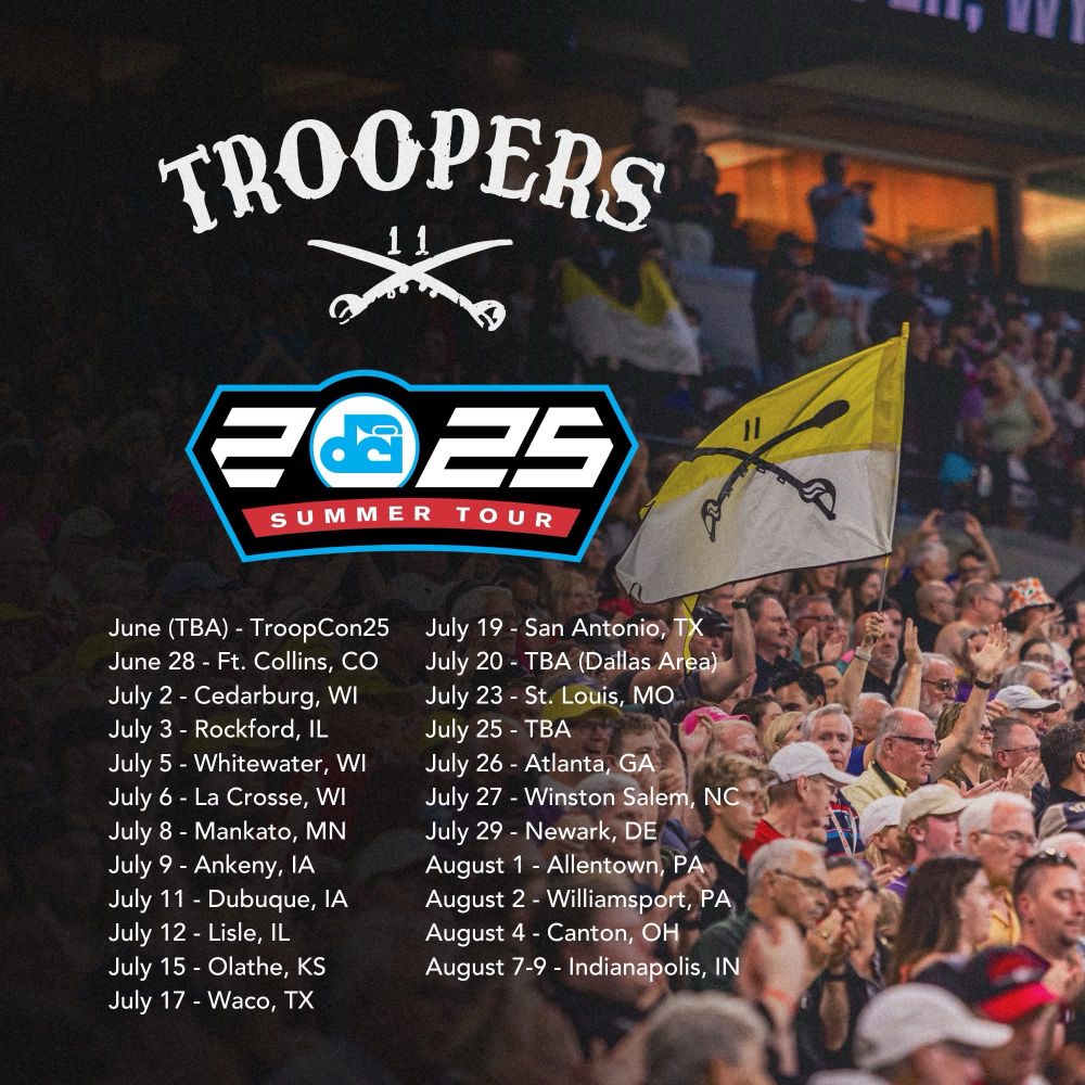 Troopers 11th Ohio calvary cross sabers logo with the Troopers gold and white flag waving in the crowd at Lucas Oil Stadium. 