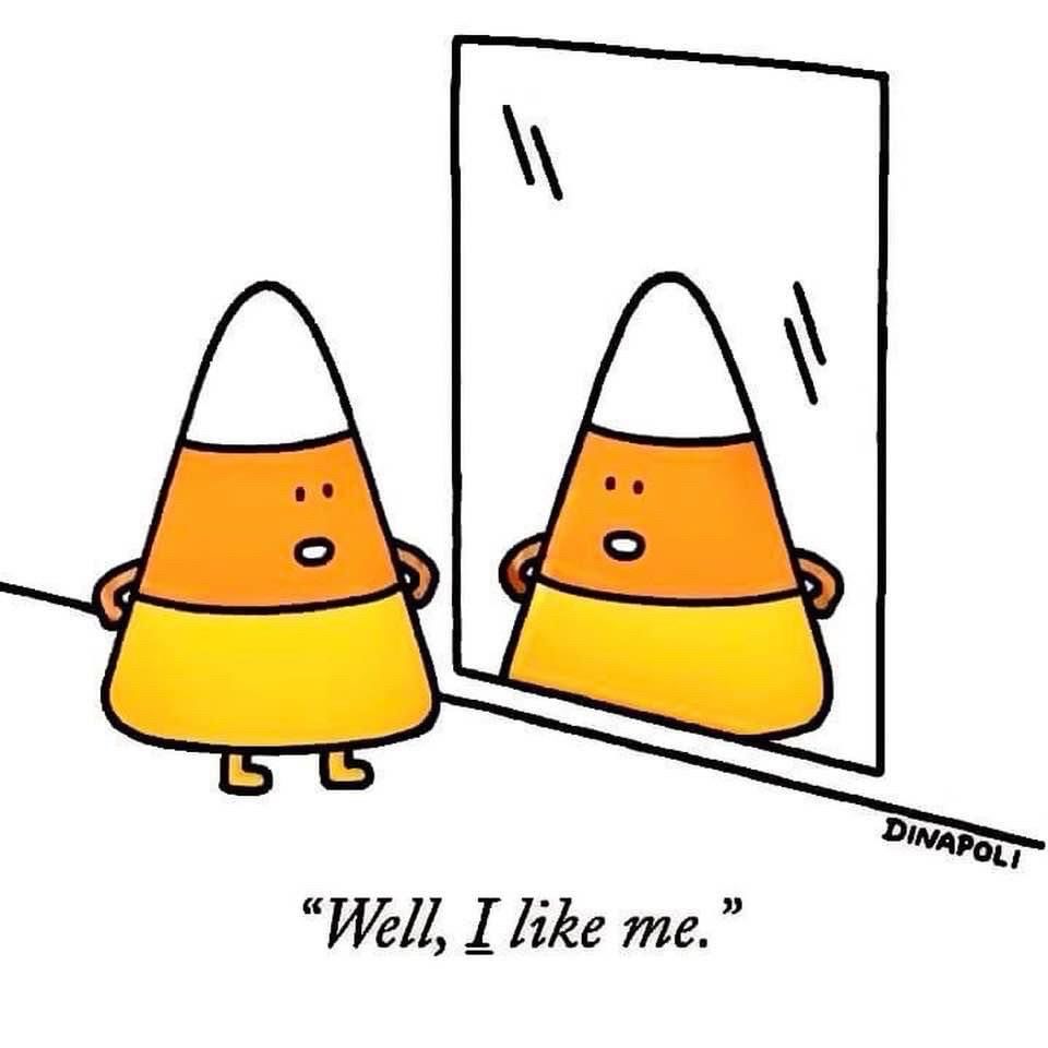 Anthropomorphic candy corn standing and posing in front of mirror quote captioned “Well, I like me.” 