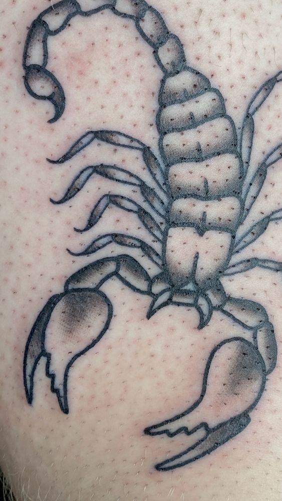 close-up tattoo of a scorpion