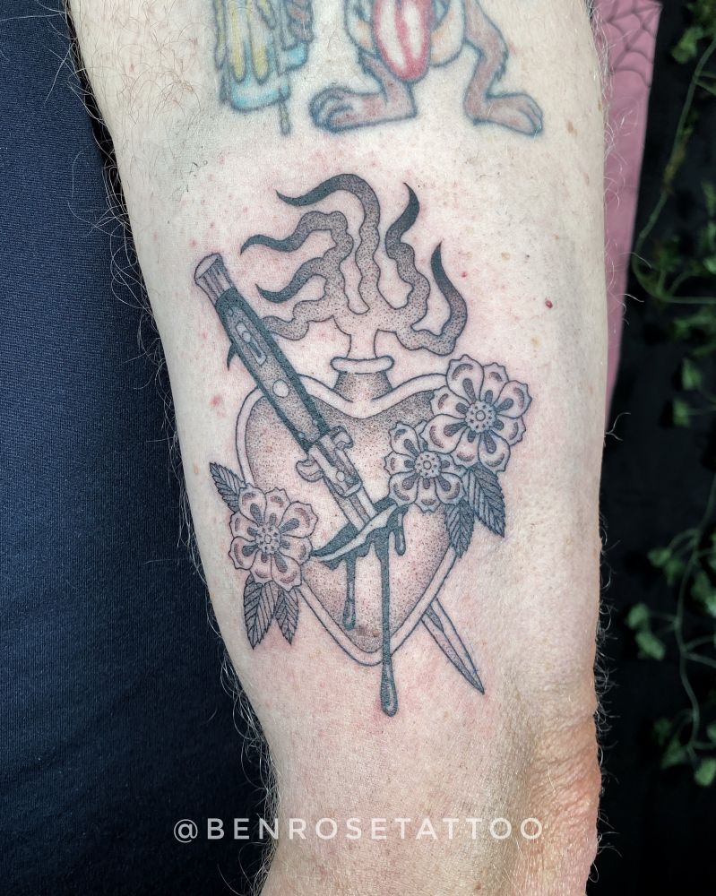 dotwork tattoo of a sacred heart with flowers and a switchblade