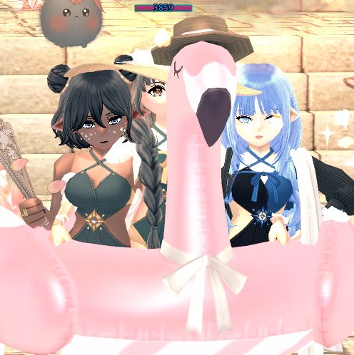 Three women in a flamingo pool tube.