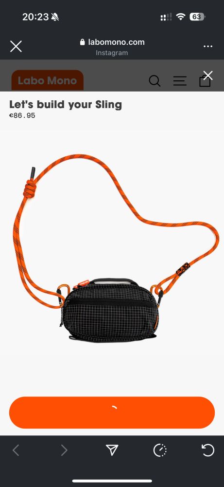 A black sling bag with an orange cord