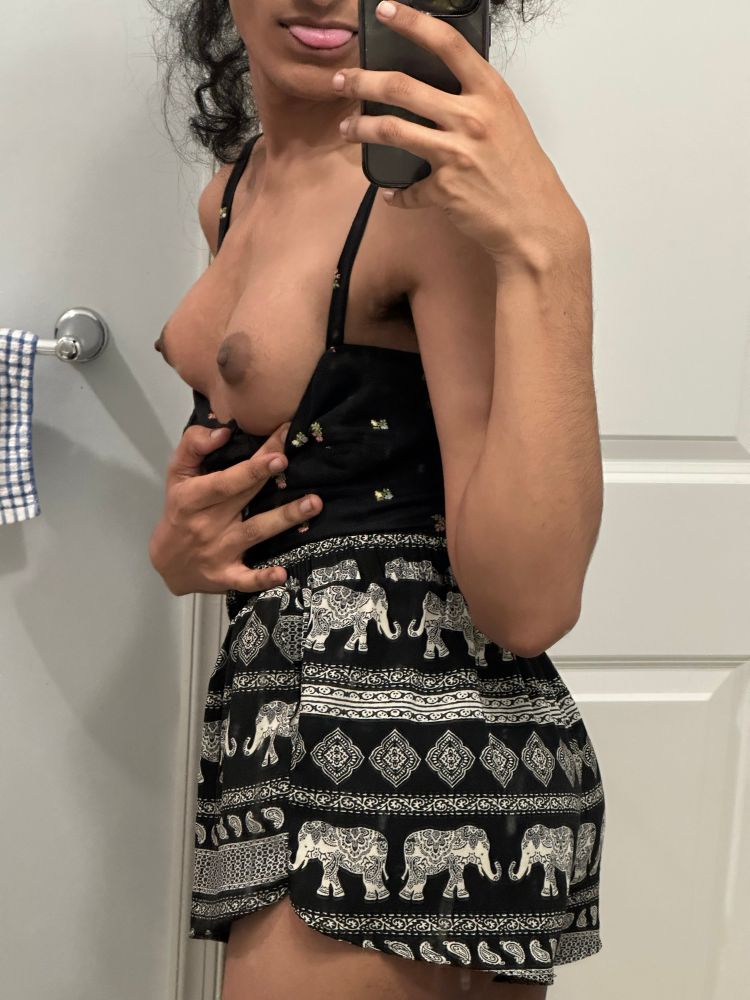 me wearing a crop top and shorts, pulling down the top to reveal my tits, while turning to the side to show my ass