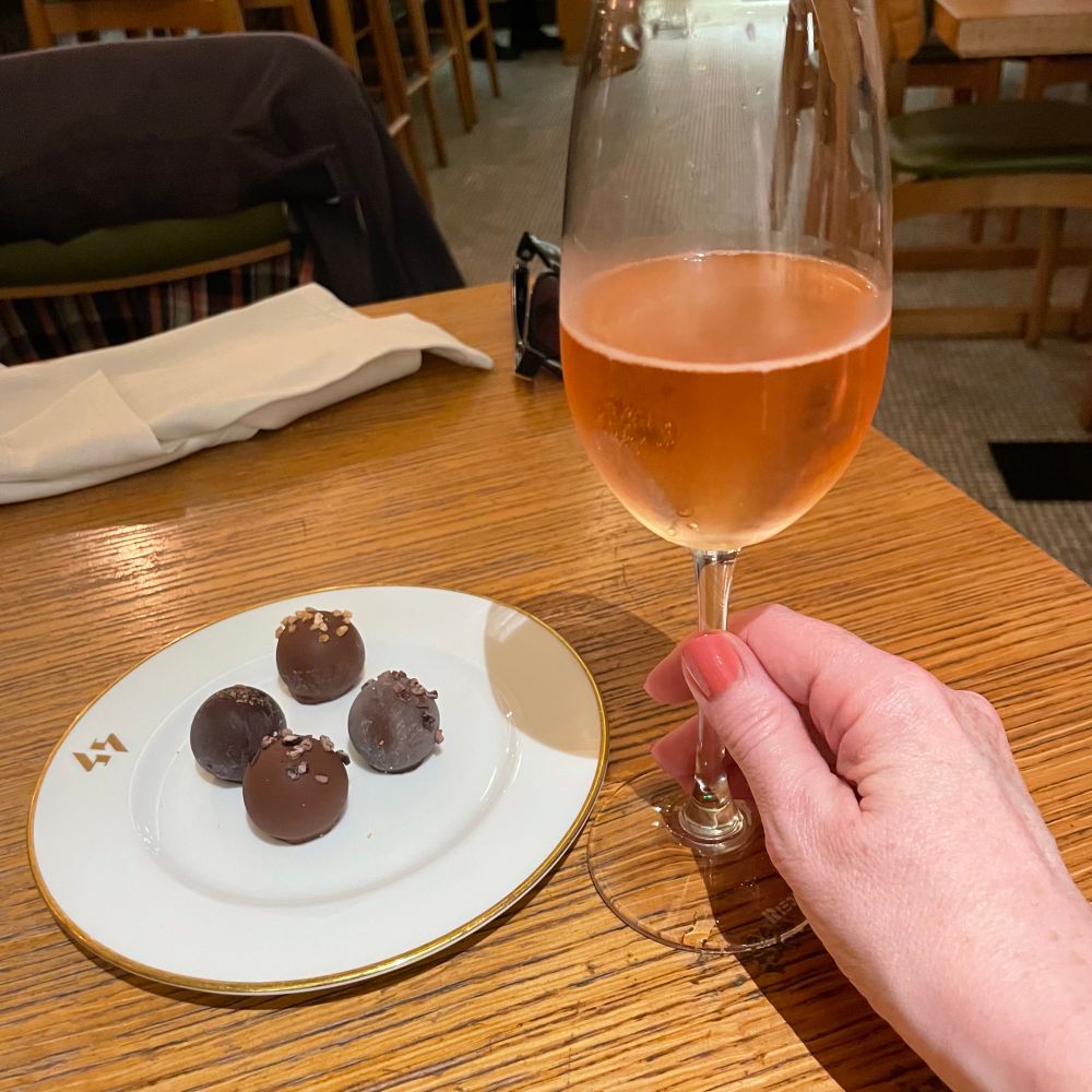 My dessert. A plate of chocolate truffles and a glass of English rose fizz. 