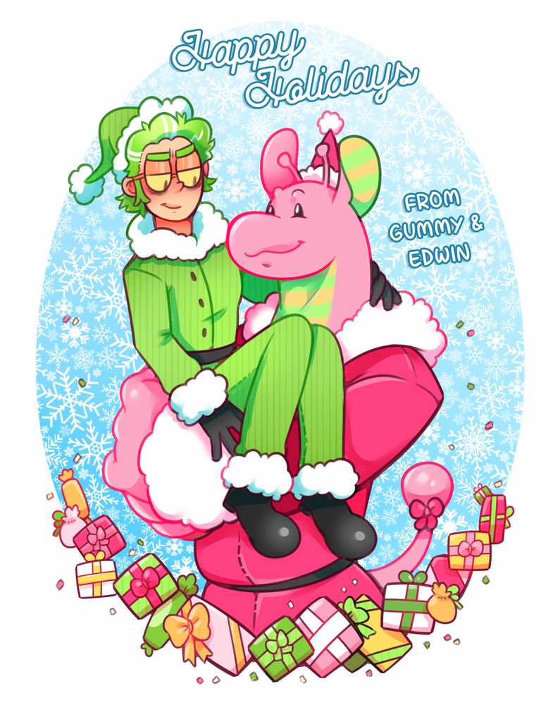 Edwin, dresses in a green santa outfit is being held by Gummy, who is wearing a pink santa outfit.