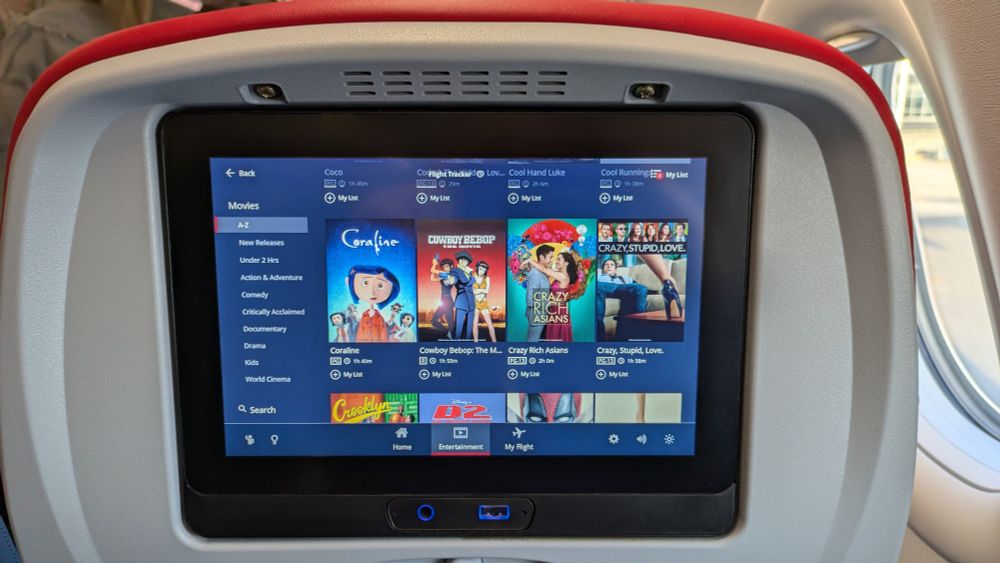 A seat back entertainment screen, with Cowboy Bebop the Movie available