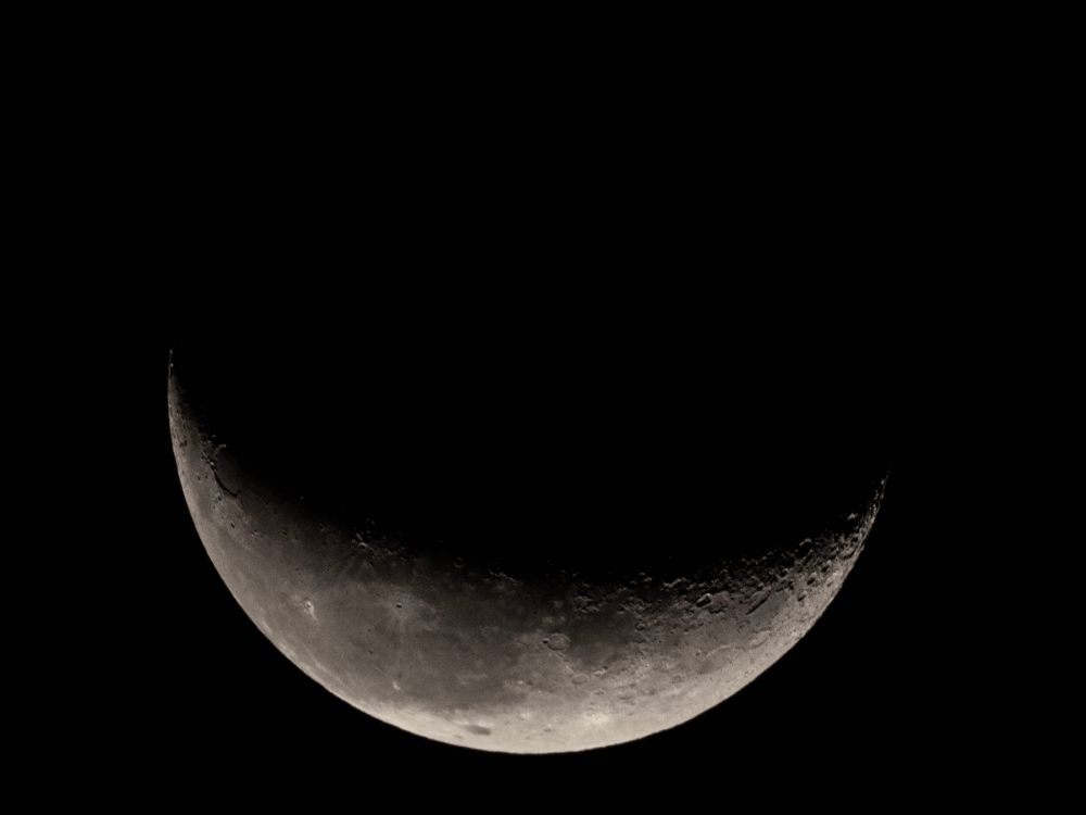 The waning crescent moon
