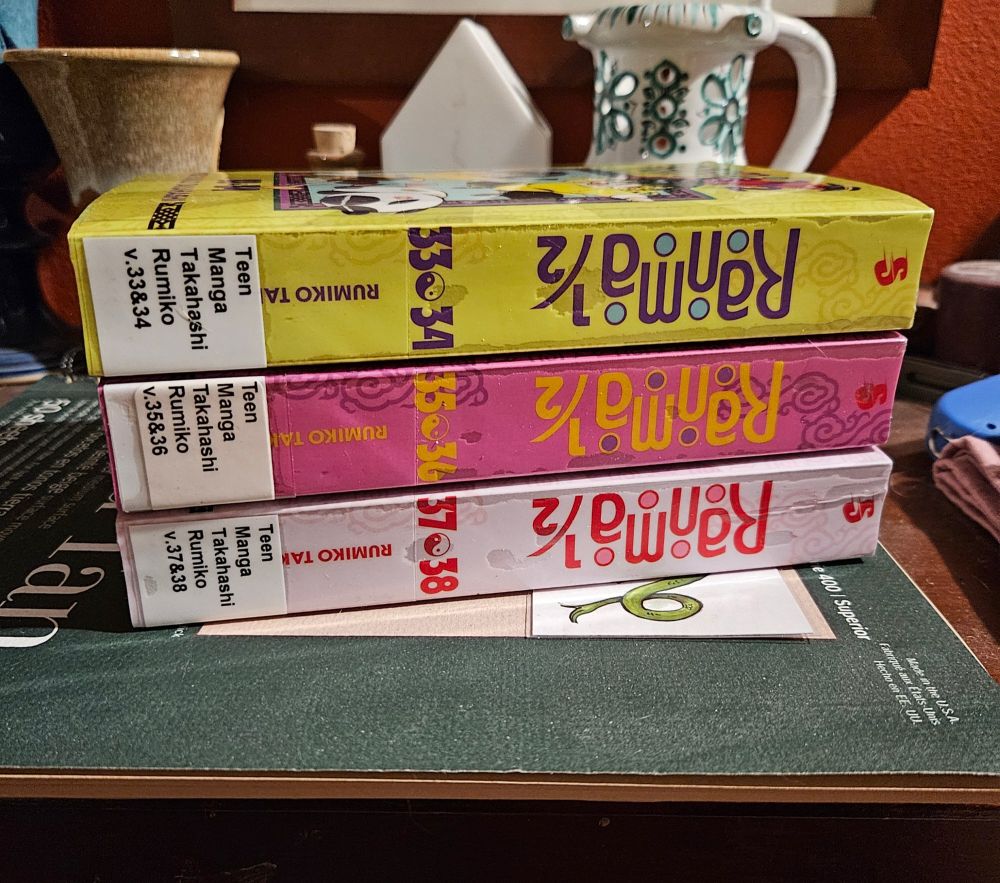 A stack of three books from the library - Ranma 1/2 volumes 33 & 34, 35 & 36, 37 & 38.