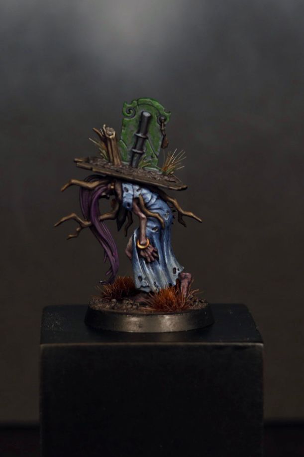 A hand-painted Warhammer zombie miniature 
