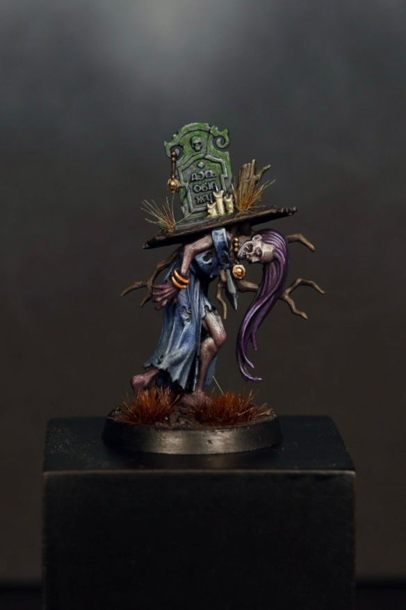 A hand-painted Warhammer zombie miniature 