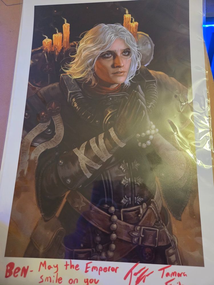 A signed print of Sister Argenta, with the personalization: Ben--May the Emperor Smile On You.

Signed by her VA, Tamara Fritz, who is really cool. 