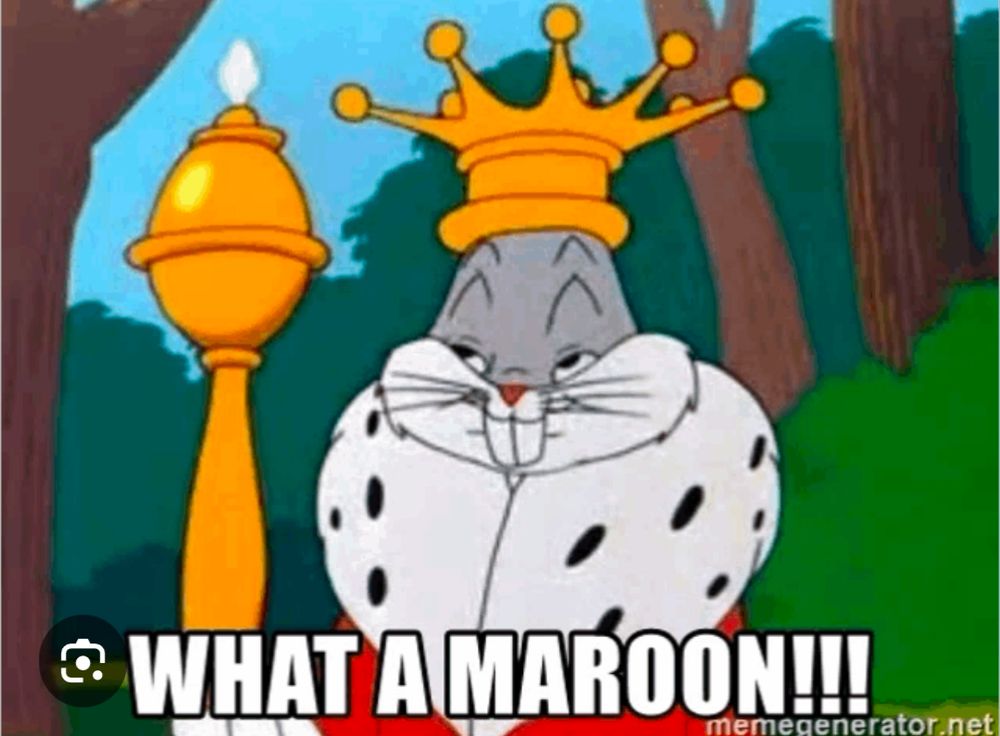 Bugs Bunny looking smug in a scepter with a Golden Crown and the mink Regal coat with the caption "What a maroon!"