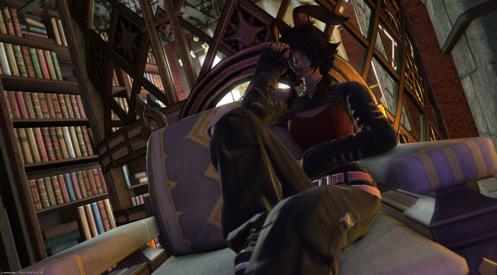 The dark red-headed Viera sits in a large armchair with one leg pulled up towards her chest as the other dangles out in front of her. With her right arm resting elbow to knee and knuckles placed against her forehead, she looks lost in thought.