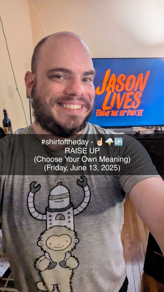@mcswagger.bsky.social in a shirt.woot.com shirt with a yeti carrying a robot, with the title card for Friday the 13th Part VI - Jason Lives in the background 
