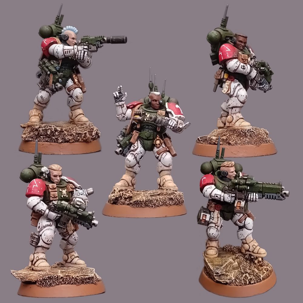 Five Female Space Marines of the Mentor Legion in scuffed-up power armour. Their colours are dark green torsos, white limbs, and red shoulder pads.
Top left, Trooper with a silenced bolt pistol.
Top right, Trooper with a bolter.
Bottom right, Trooper with a heavy bolter.
Bottom left, Medic with a bolter and med dispenser.
Centre, Sergeant with bolter and comm unit.