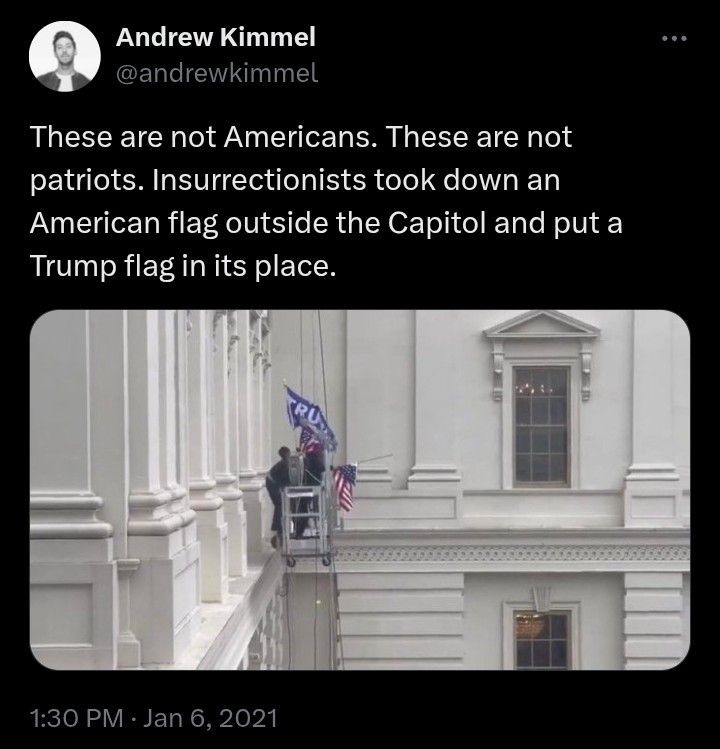 @andrewkimmel tweet on january 6, 2021 showing a photo of insurrectionists removing an american flag and replacing it with a trump flag. (they then threw the american flag to the ground)