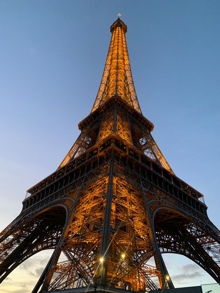 The view of the Eiffel Tower in Paris, France in the evening. 