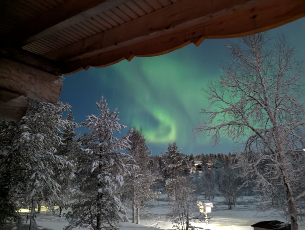 Aurora Borealis.
A green fish hook dangling in the sky. 