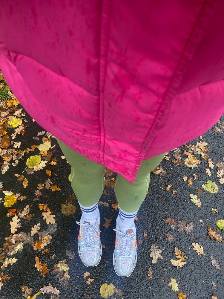 Pink puffer coat and green leggings 