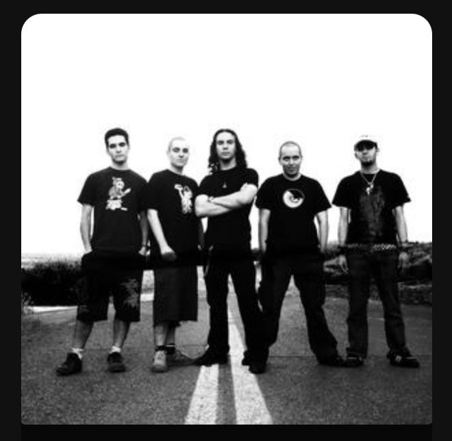 An album cover showing five young men dressed in black, posing in the middle of a road and looking dangerous. Very metal.