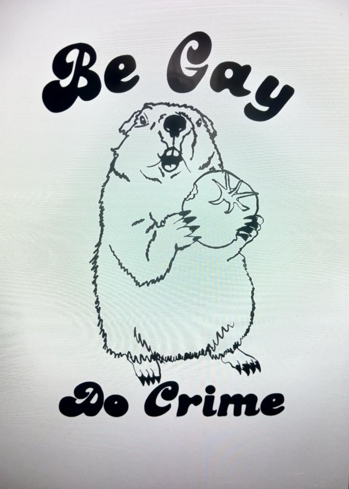 t-shit that says “be gay, so crime” featuring a groundhog in the center eating a tomato