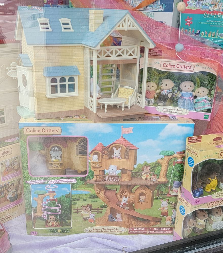 Shop window display with Calico Critters figures, cottage, and tree house playsets. I haven't seen or thought of these in ages. Was walking home through West Roxbury and saw this time capsule
