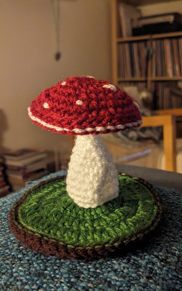 Crochet toadstool on the arm of a sofa