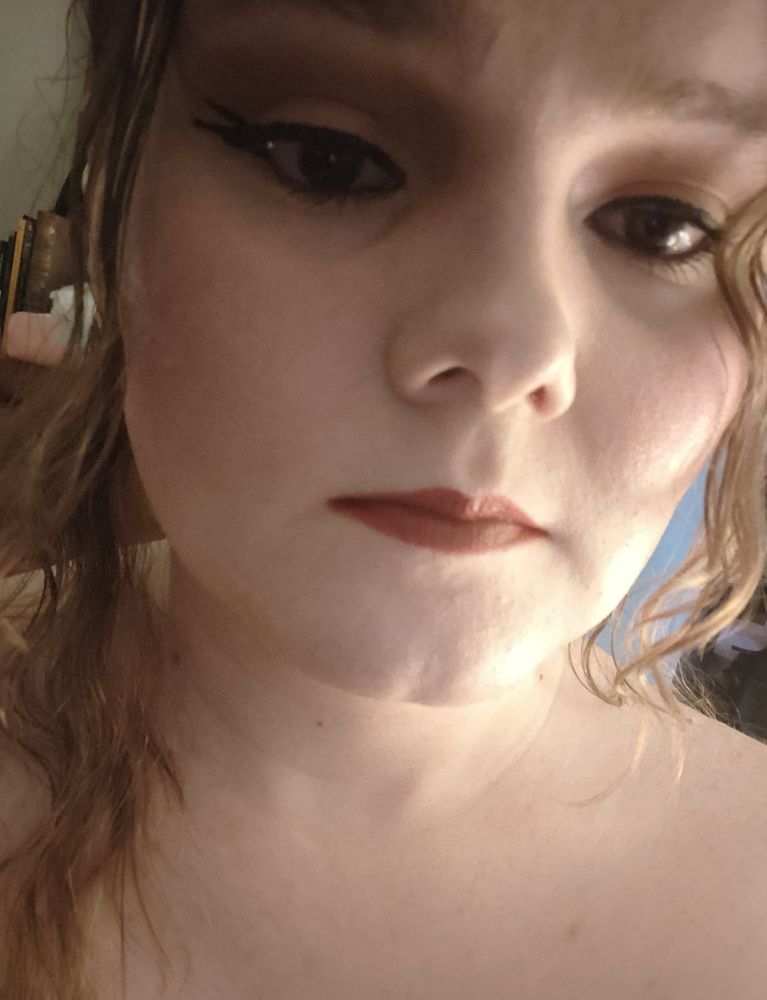 a selfie of her wearing dollish makeup 