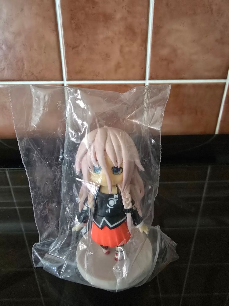 A photograph of the IA mini figure by Akia-AP, in it's bag