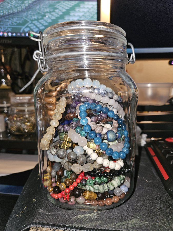mason jar full of bracelets