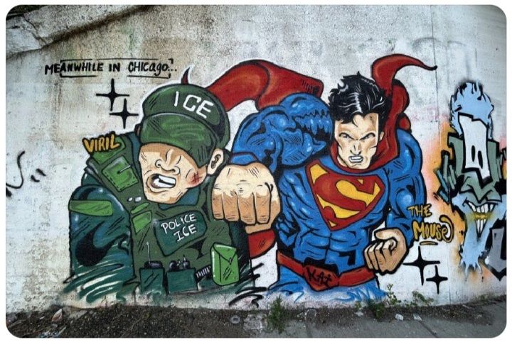 a painting on an underpass wall of Superman punching out an ICE goon